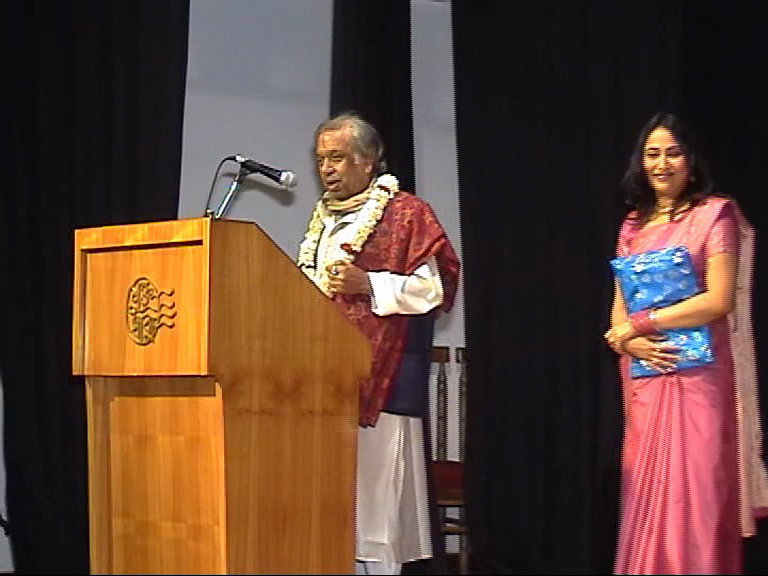 Guest speaker at podium during dance academy event