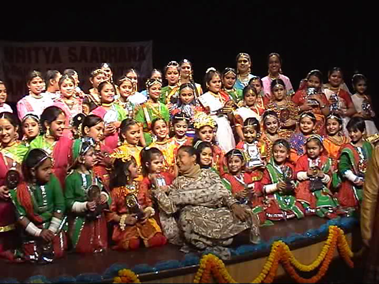Children performing traditional cultural dance on stage