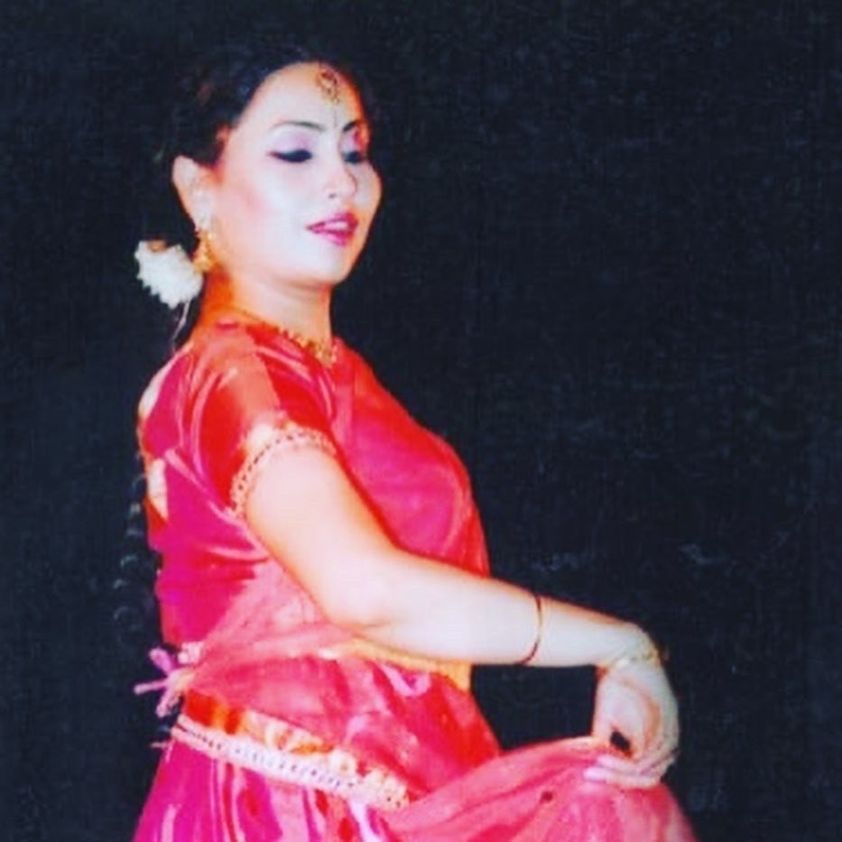Dancer in red and pink classical Indian dance portrait
